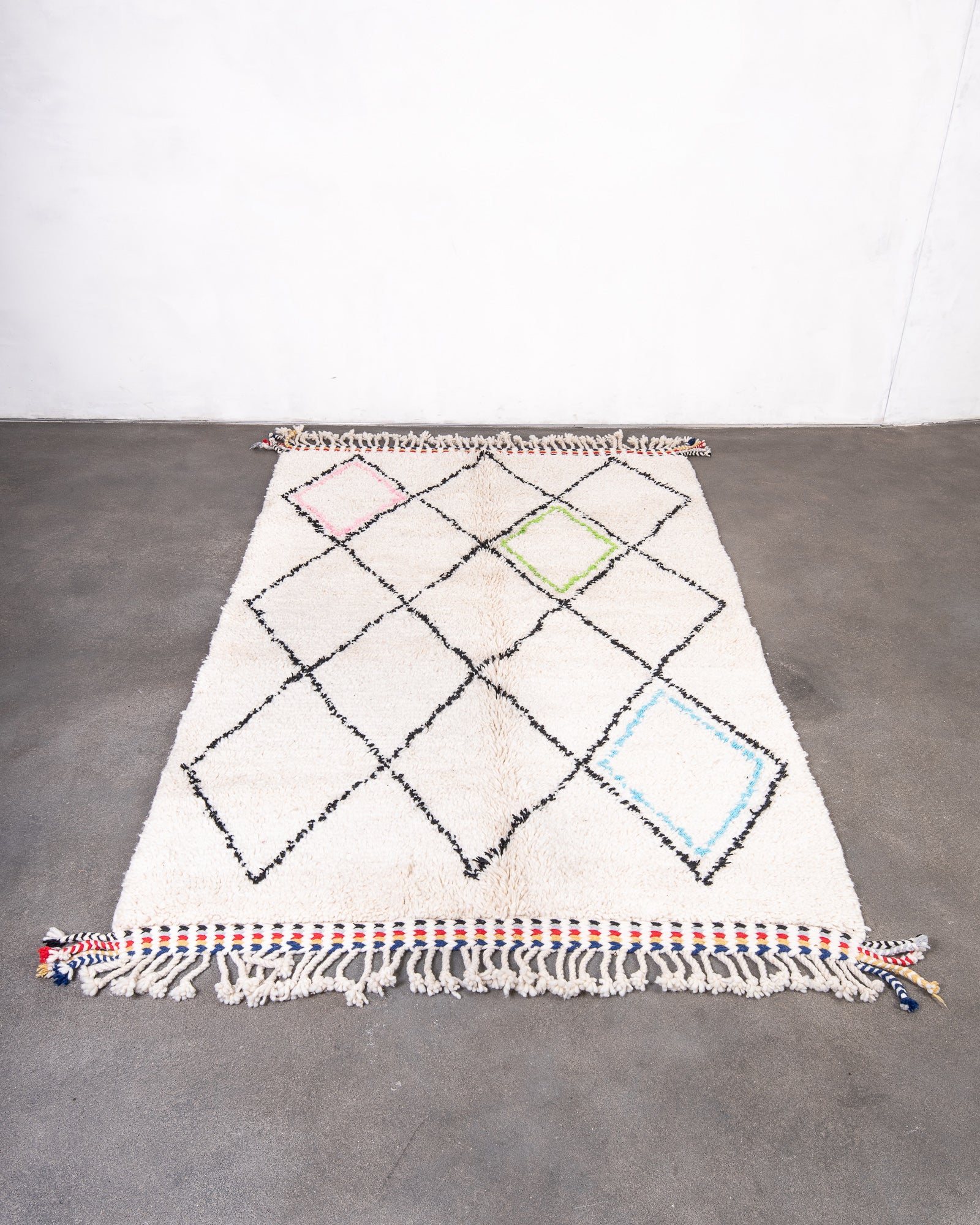 Modern, designer, handcrafted Berber rug from Morocco. Beniourain carpet with beautiful colours and patterns and fluffy wool texture.